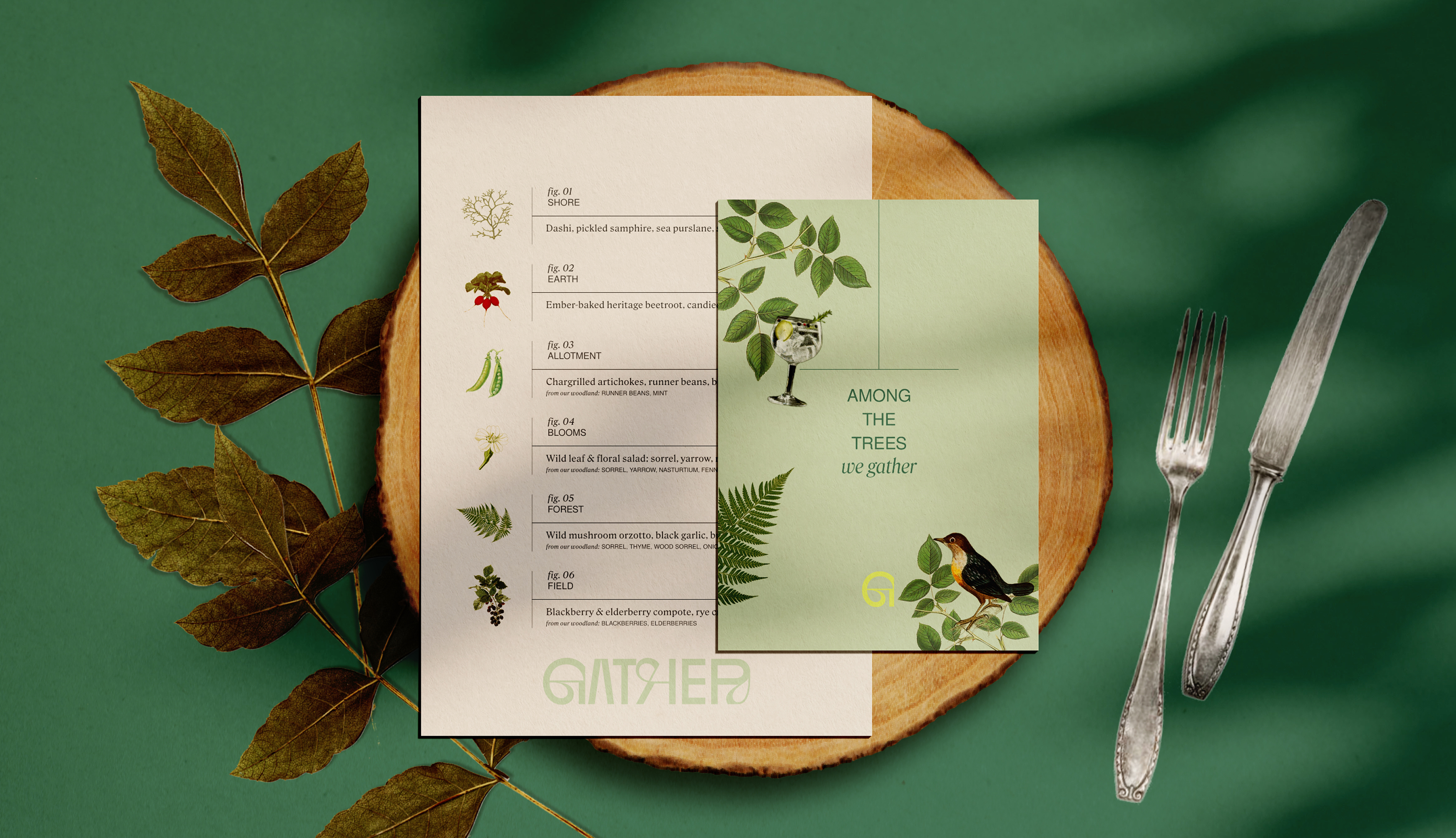 A Gather tasting menu and a pale green card reading Among the Trees we gather, laid on a wooden slice on a green table beside a pressed leaf, a vintage fork and a knife. The menu lists six courses from Shore to Field, each with a botanical illustration