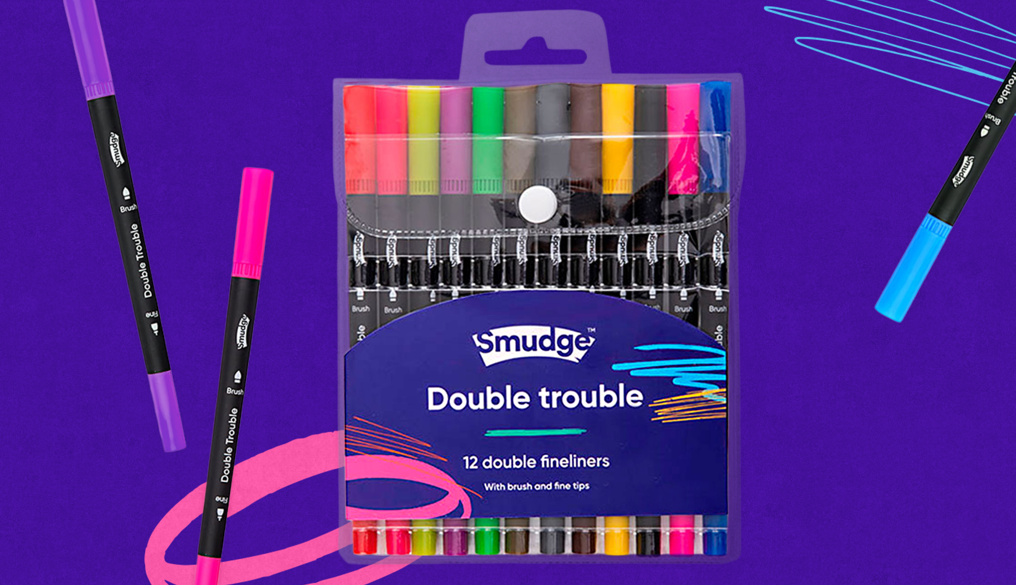 A pack of Smudge Double Trouble fineliners on purple, two loose pens beside it and scribbles in pink, orange and blue